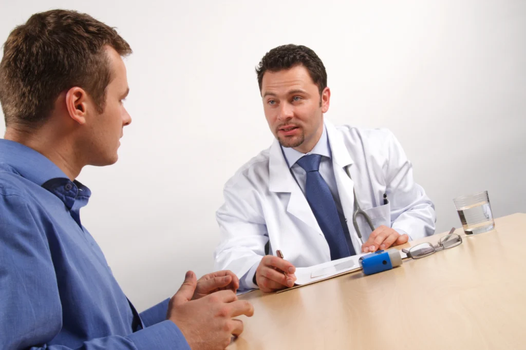 A doctor speaks with a patient
